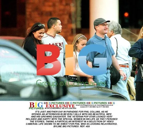 Phil Collins Shops With Family