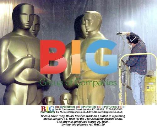 Scenic artist Tony Meisel works on Oscars statue