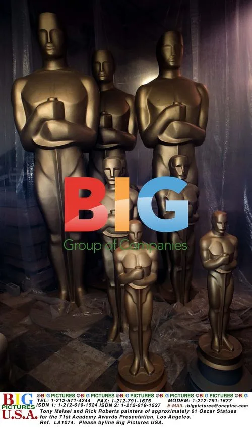 Tony Meisel and Rick Roberts paint Oscar statues