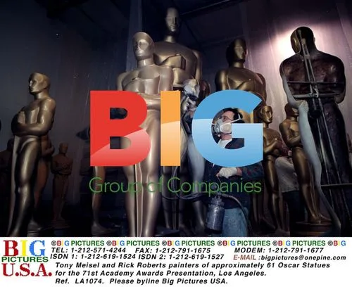 Tony Meisel and Rick Roberts paint Oscar statues