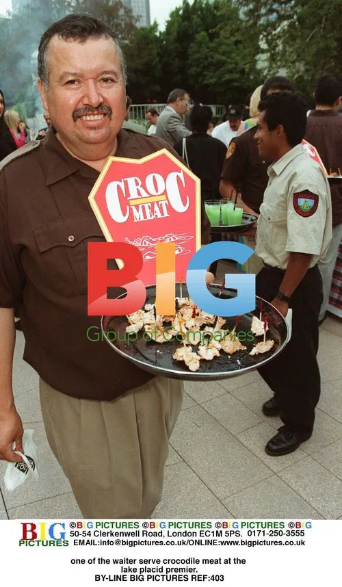 Waiter serves crocodile meat at Lake Placid premiere