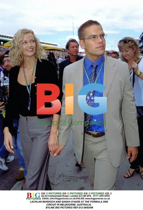 Lachlan Murdoch and Sarah O'Hare at Formula One Circuit