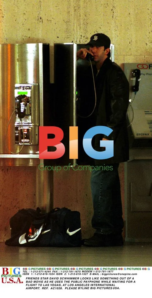 David Schwimmer uses payphone at LAX