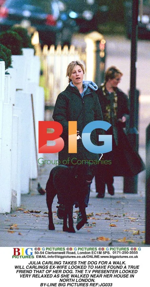 Julia Carling takes dog for walk in North London