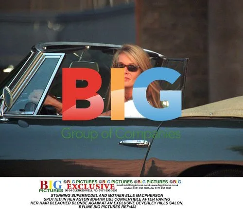 ELLE MACPHERSON SPOTTED IN ASTON MARTIN