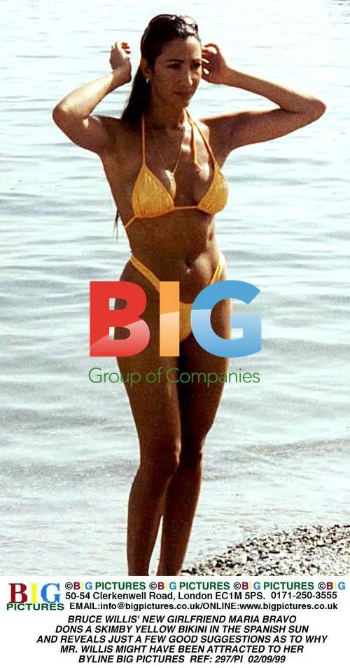 Maria Bravo Poses in Yellow Bikini
