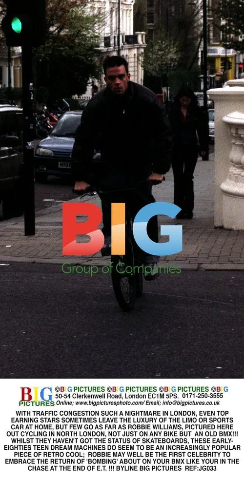 Robbie Williams Cycles on BMX Bike