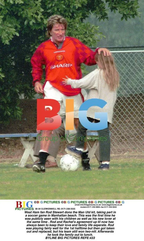 Rod Stewart plays soccer in Man Utd kit