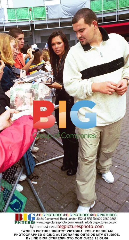 Victoria 'Posh' Beckham Signing Autographs