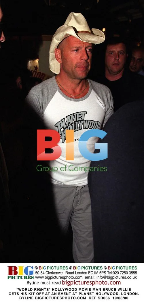 Bruce Willis Strips at Planet Hollywood