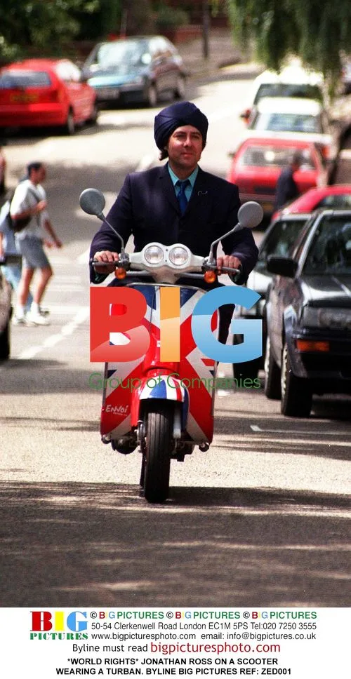 Jonathan Ross Rides Scooter in Turban