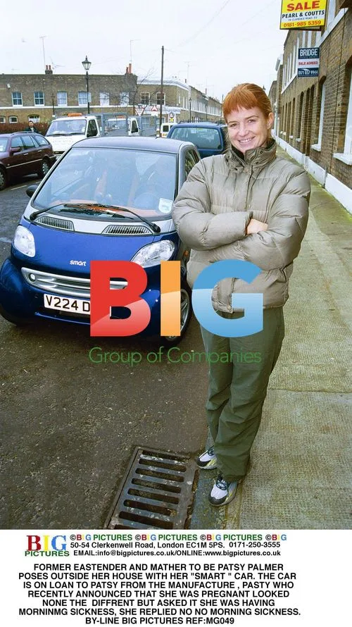 Patsy Palmer Poses with Smart Car