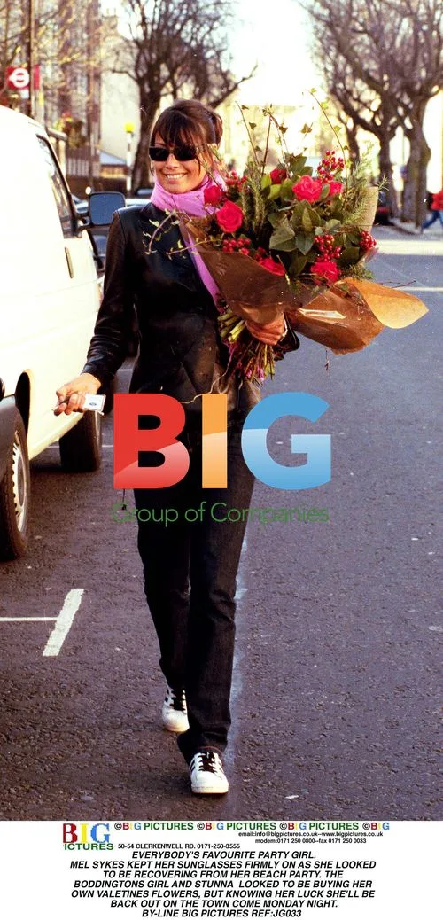 Mel Sykes Buys Flowers