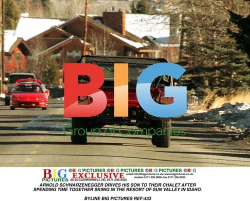 ARNOLD SCHWARZENEGGER DRIVES SON TO CHALET