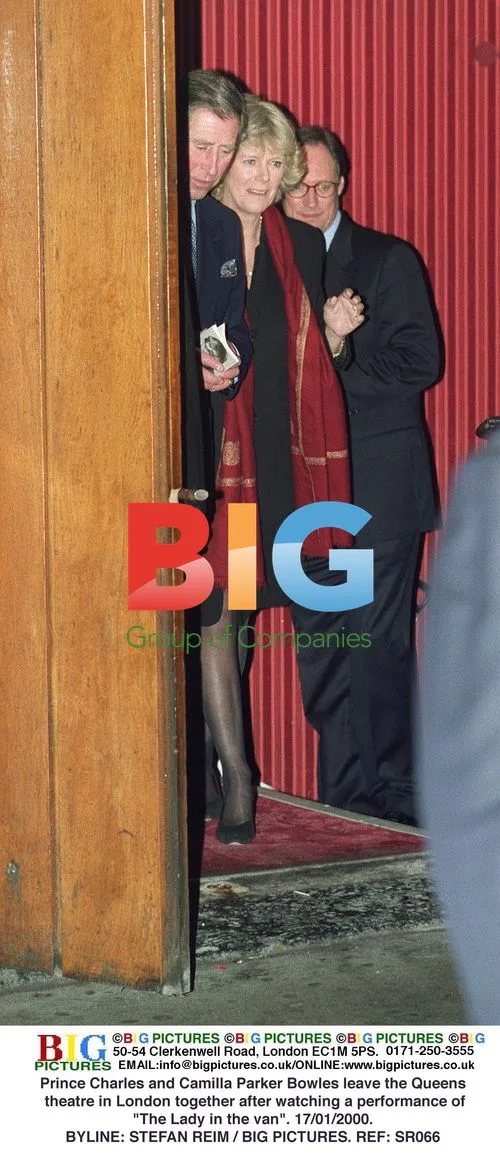 Prince Charles and Camilla exit London theatre