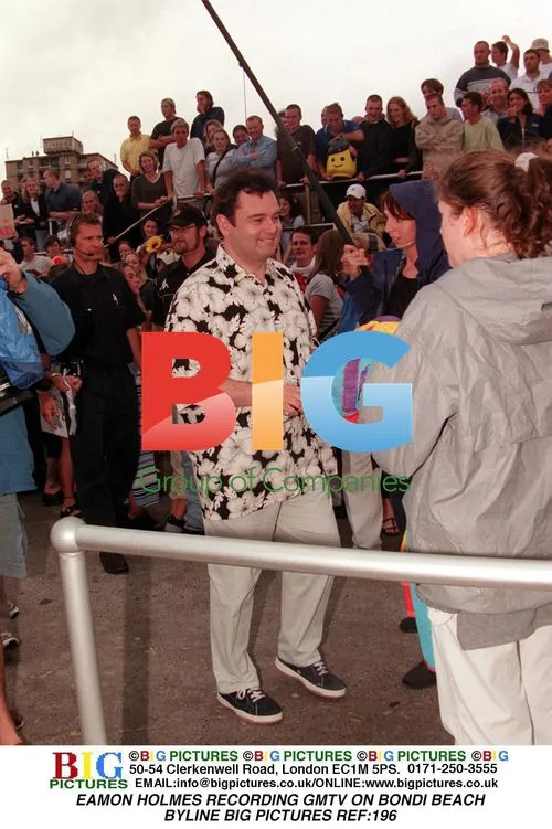 Eamon Holmes records GMTV on Bondi Beach
