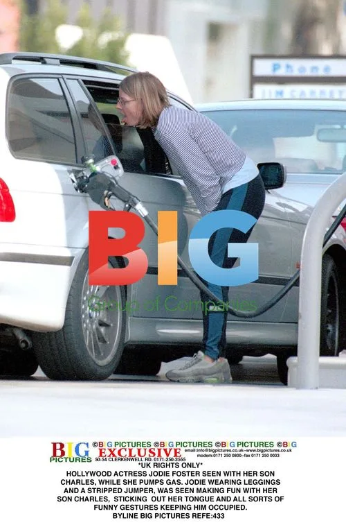 Jodie Foster Pumps Gas with Son