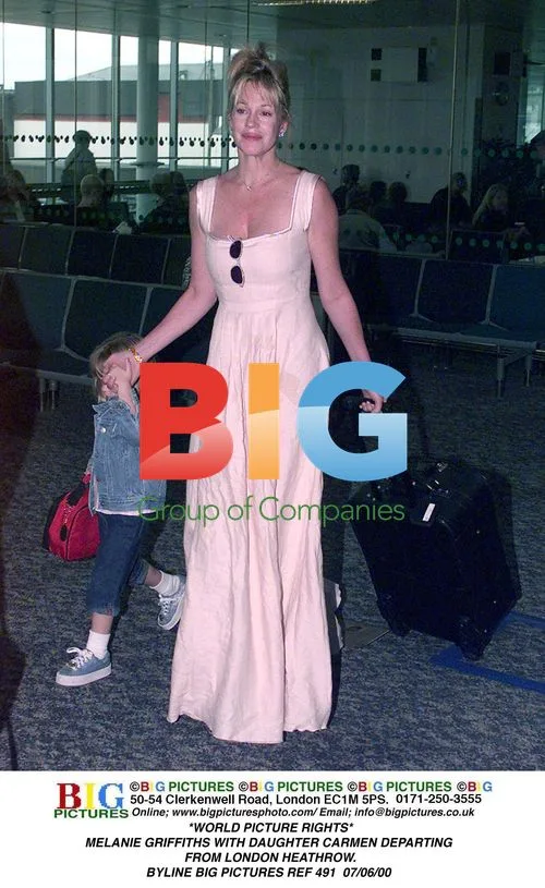 Melanie Griffiths with daughter Carmen departing Heathrow