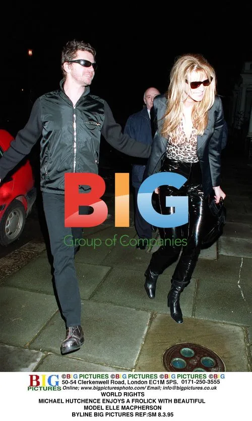 MICHAEL HUTCHENCE and ELLE MACPHERSON frolic