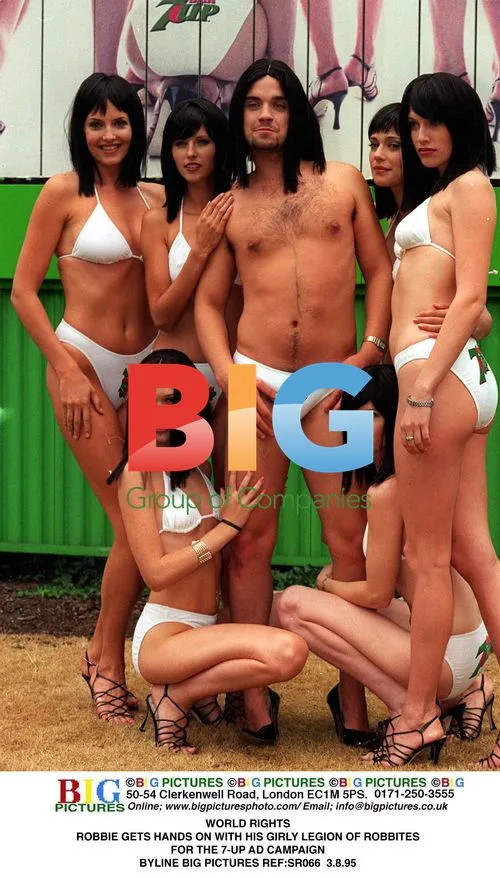 Robbie Williams poses with "Robbites" for 7-Up ad