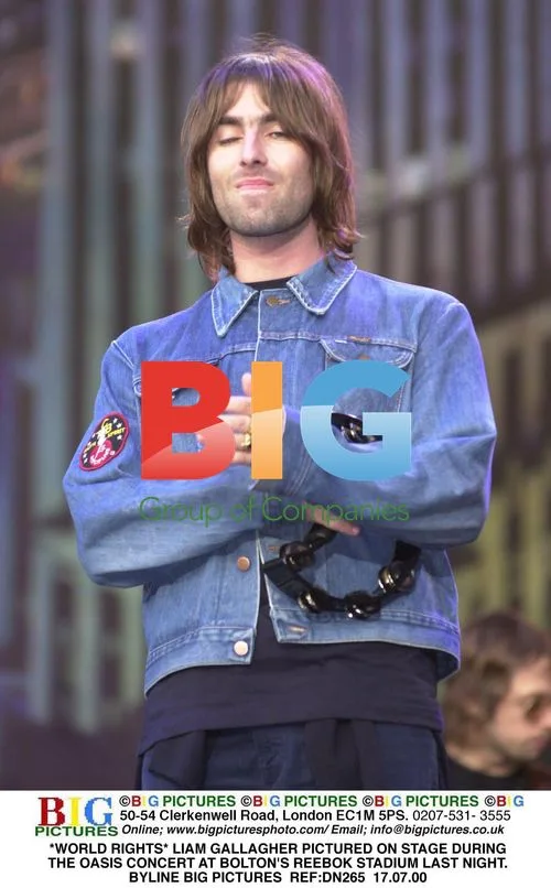 Liam Gallagher Performs with Oasis at Reebok Stadium