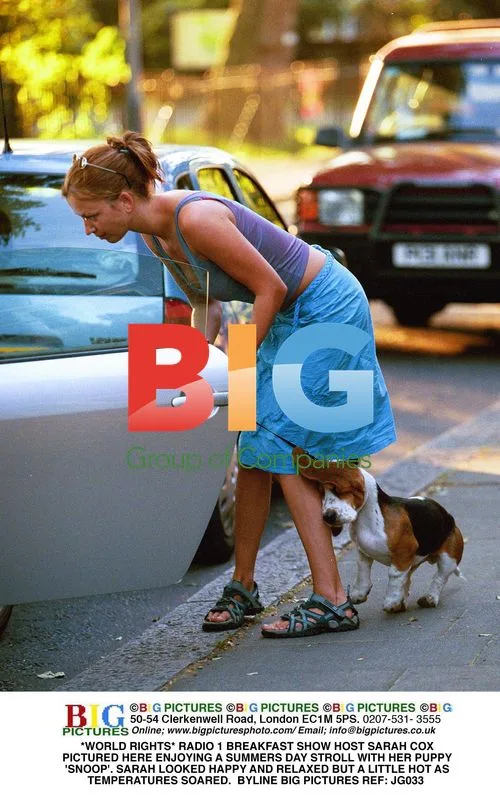 Sarah Cox Enjoys Summer Stroll with Puppy