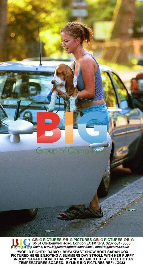 Sarah Cox Strolls with Puppy 'Snoop'