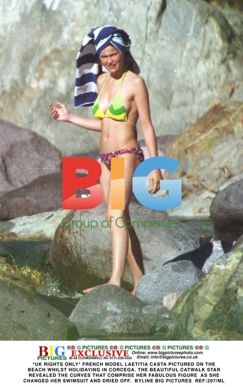 Laetitia Casta Pictured Topless on Beach in Corcega