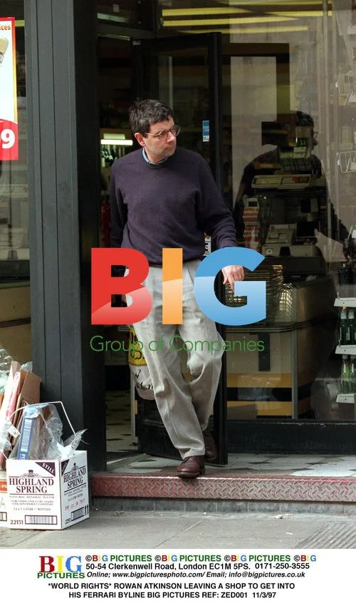 Rowan Atkinson Leaving Shop in Ferrari