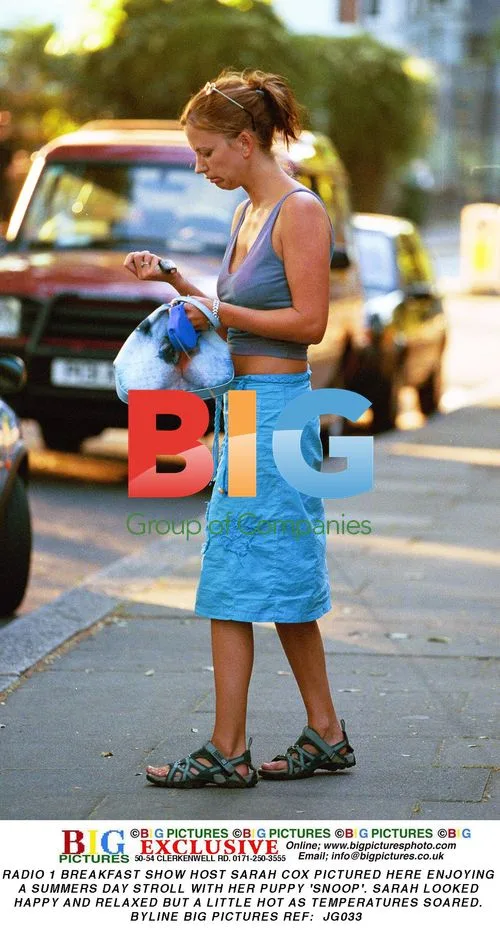 Sarah Cox Enjoys Summer Stroll with Puppy