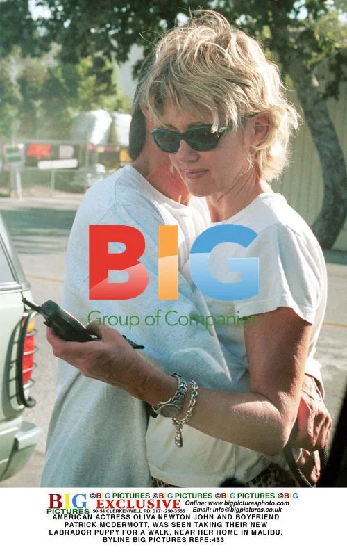 Olivia Newton-John Takes Puppy for Walk
