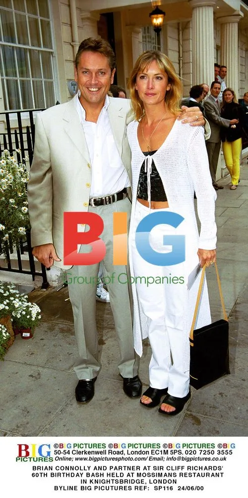 BRIAN CONNOLLY AND PARTNER AT SIR CLIFF RICHARDS' 60TH BIRTHDAY