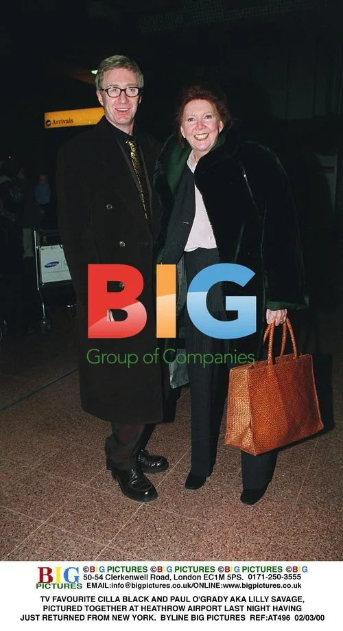 Cilla Black and Paul O'Grady at Heathrow