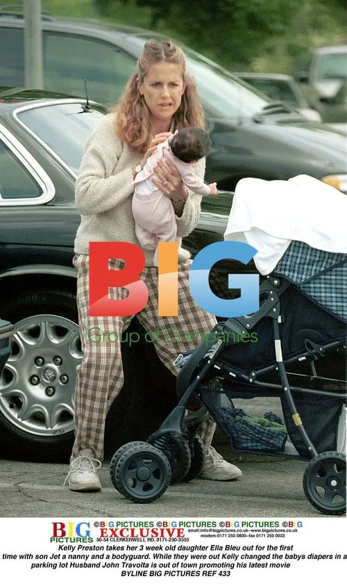 Kelly Preston and family out with newborn