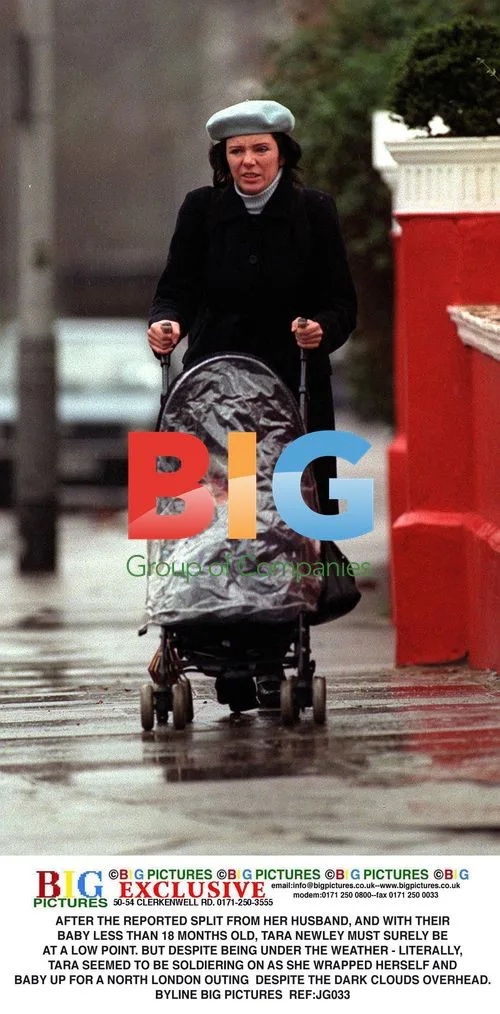 Tara Newley Braves North London Rain with Baby
