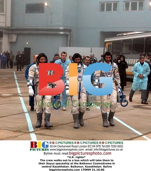 Crew walks to Soyuz spaceship in Baikonur