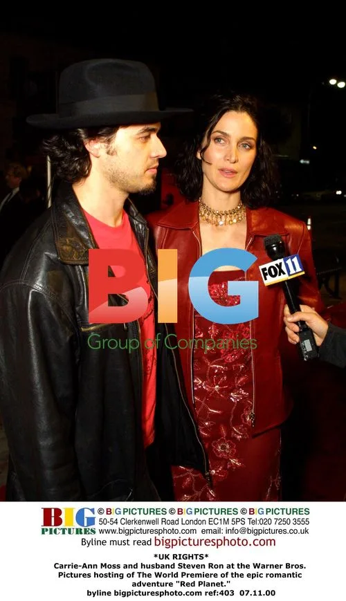 Carrie-Ann Moss and husband at "Red Planet" premiere