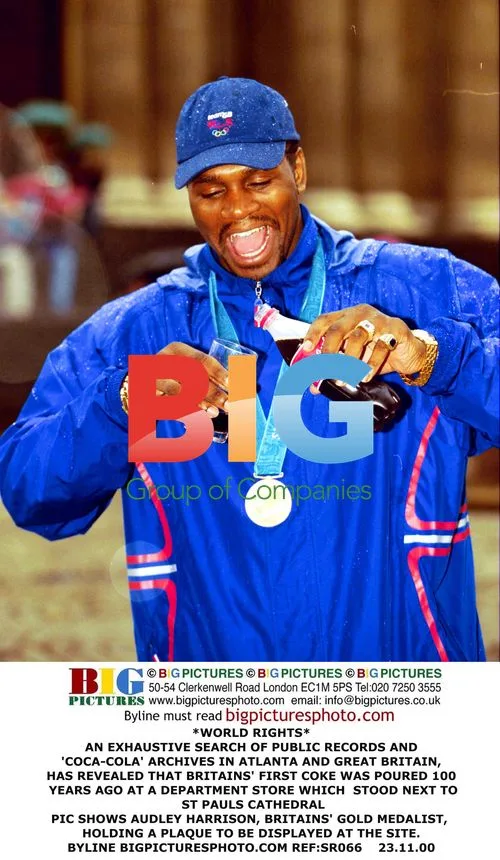 Audley Harrison Holds Coke Plaque