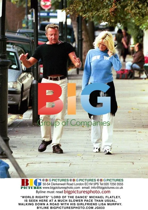 Michael Flatley and girlfriend Lisa Murphy walking
