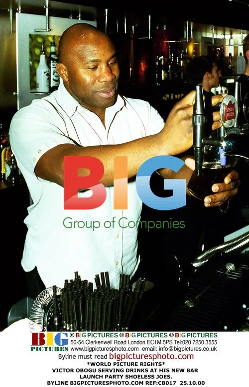 Victor Obogu Serving Drinks at Bar Launch