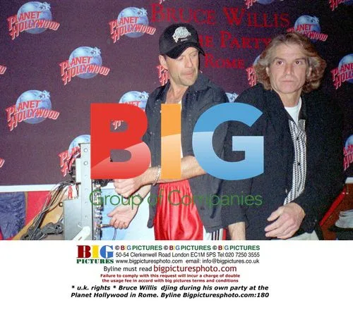 Bruce Willis DJs at Planet Hollywood Rome Party