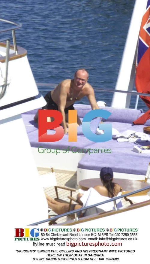 Phil Collins and Pregnant Wife on Boat in Sardinia