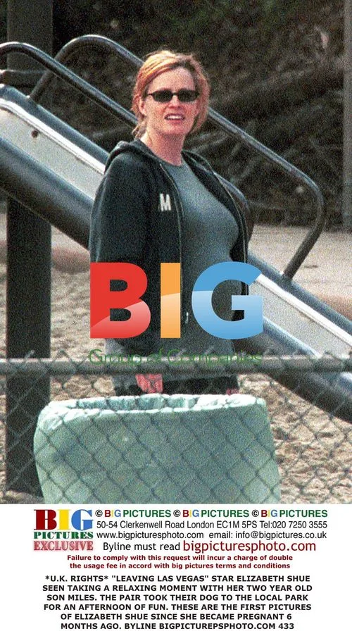 Elizabeth Shue Relaxes with Son in Park