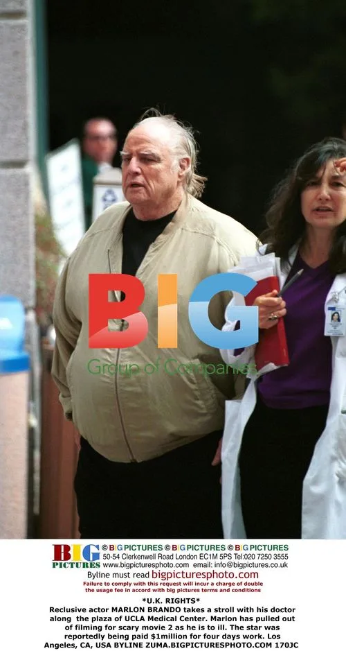 Marlon Brando takes stroll with doctor