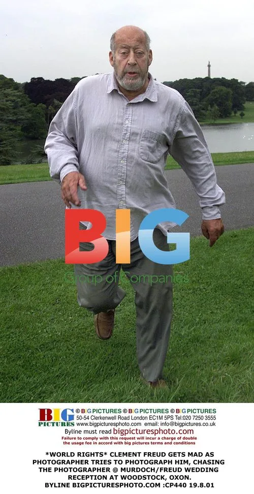 Clement Freud Chasing Photographer at Wedding