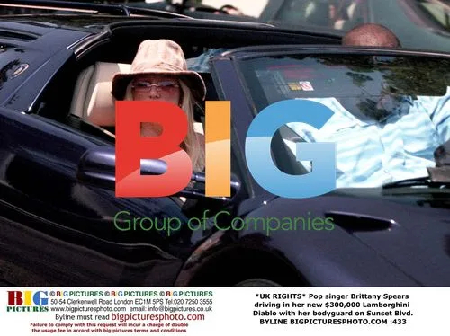 Britney Spears drives Lamborghini Diablo with bodyguard