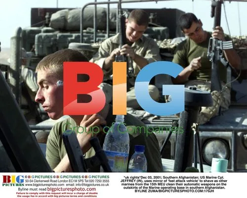 US Marines Clean Weapons in Afghanistan