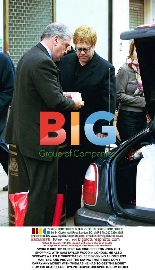 Elton John Out Shopping with Sam Taylor Wood in London
