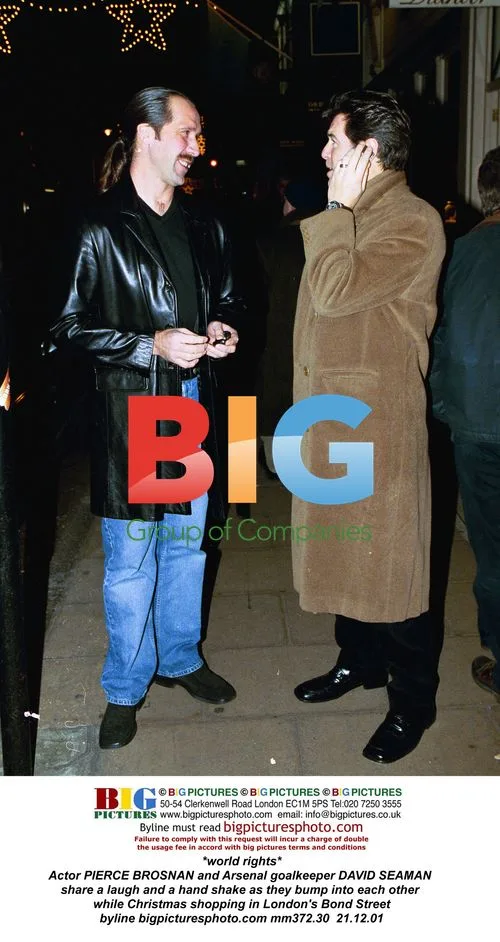 Pierce Brosnan and David Seaman Bumping Into Each Other