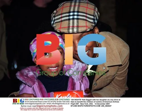 Rah Diggah and daughter at toy drive